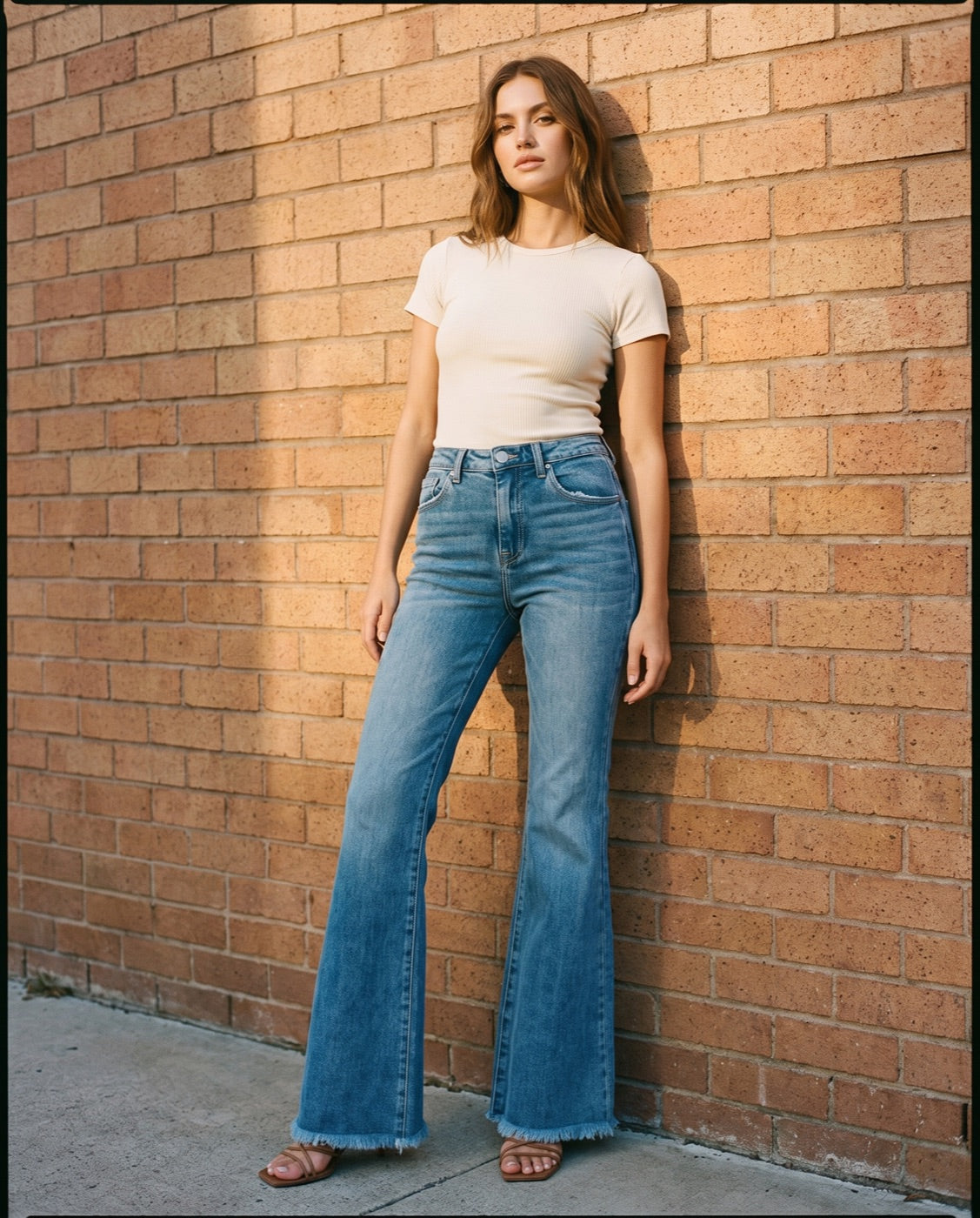 High Waist Raw Hem Flare Jeans in Medium Wash