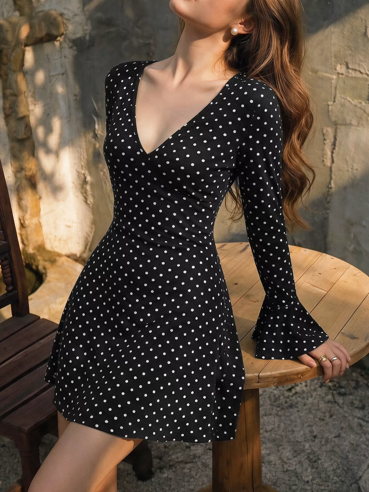 Polka Dot Long Sleeve Ruffle Hem Mini Dress in Black