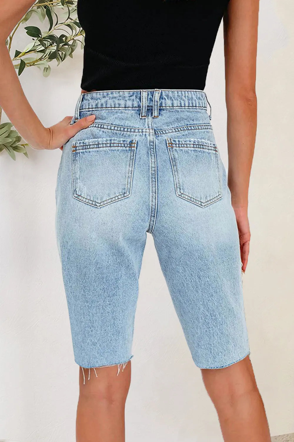 Distressed Pocketed Denim Shorts in Light Wash by DE.C.H & K.M