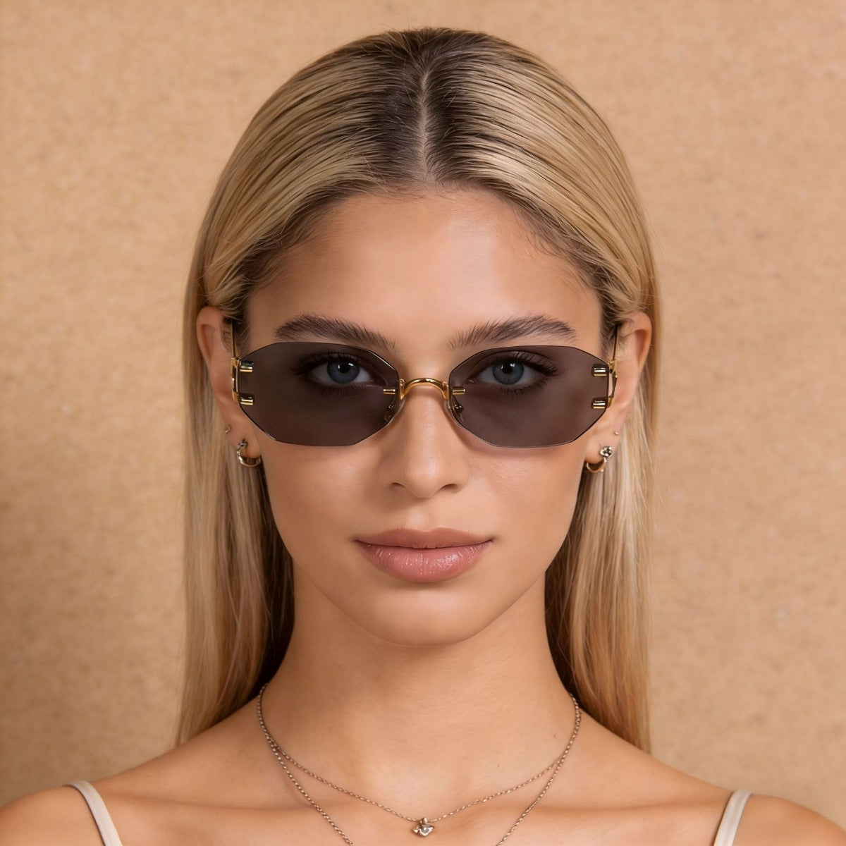 Ilussa Rimless Oval Sunglasses in gold