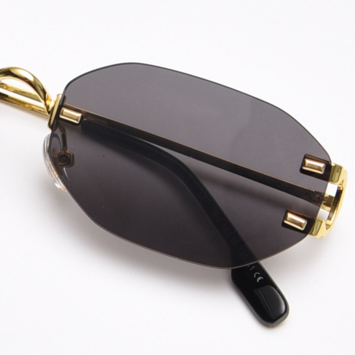Ilussa Rimless Oval Sunglasses in gold
