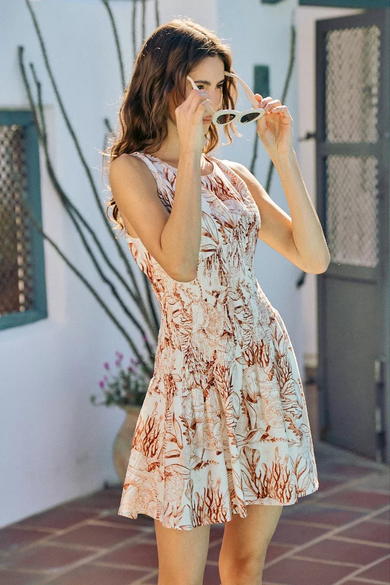 So Me Shell Print Smocked Mini Dress in Taupe
