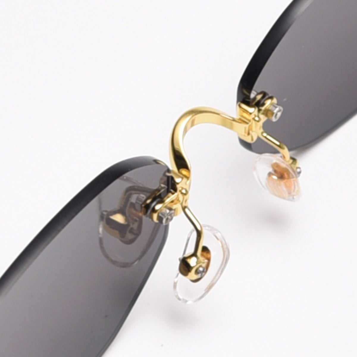 Ilussa Rimless Oval Sunglasses in gold