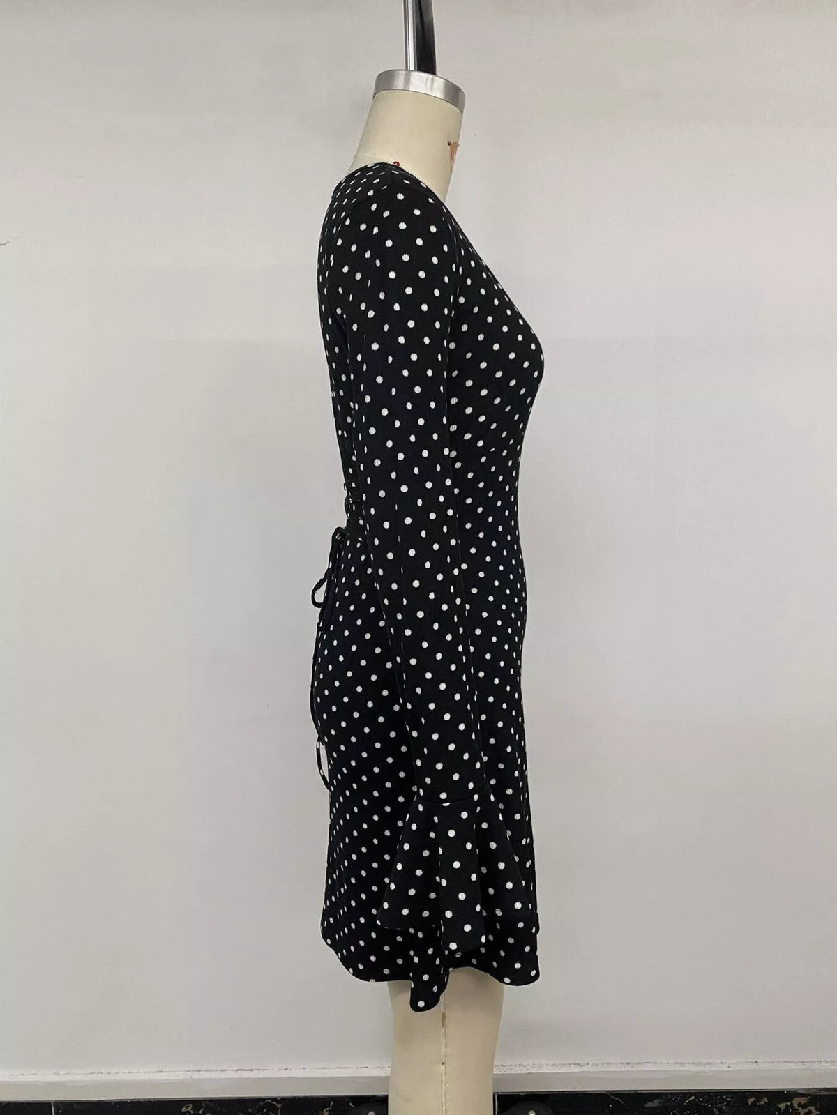 Polka Dot Long Sleeve Ruffle Hem Mini Dress in Black