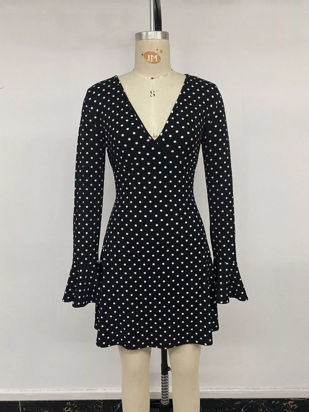 Polka Dot Long Sleeve Ruffle Hem Mini Dress in Black