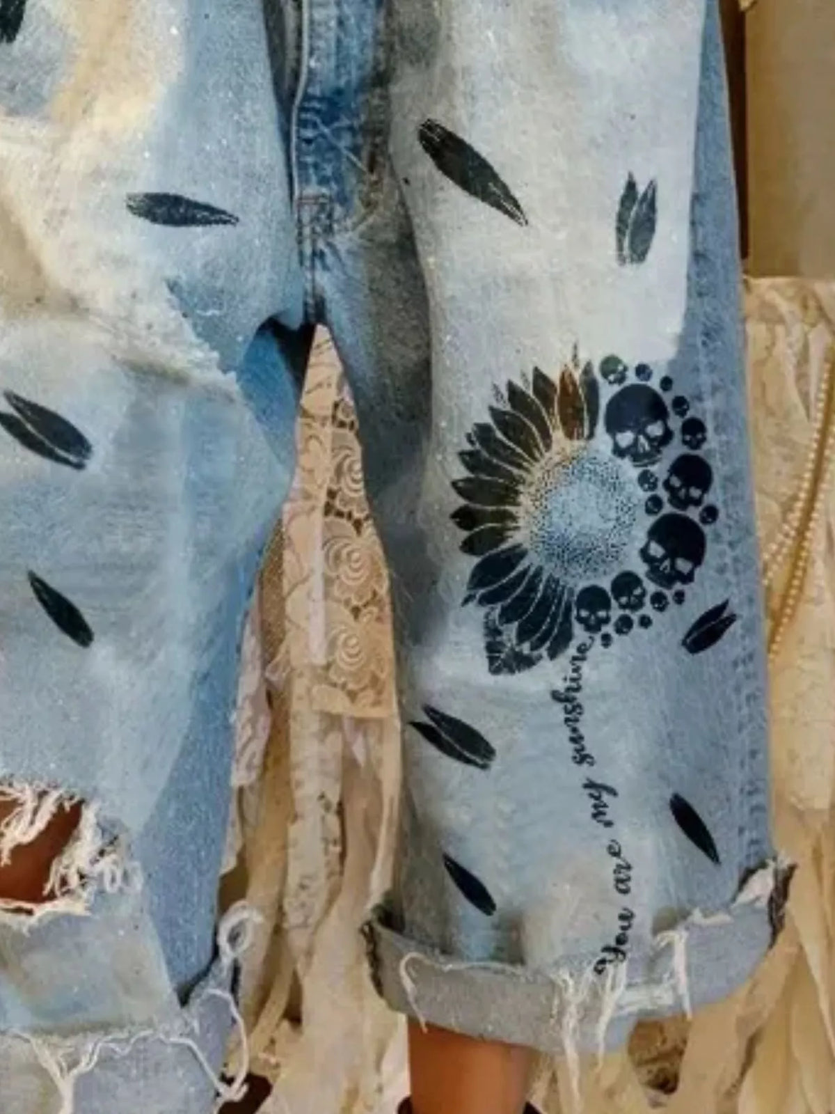 Distressed Skull Print Raw Hem Jeans