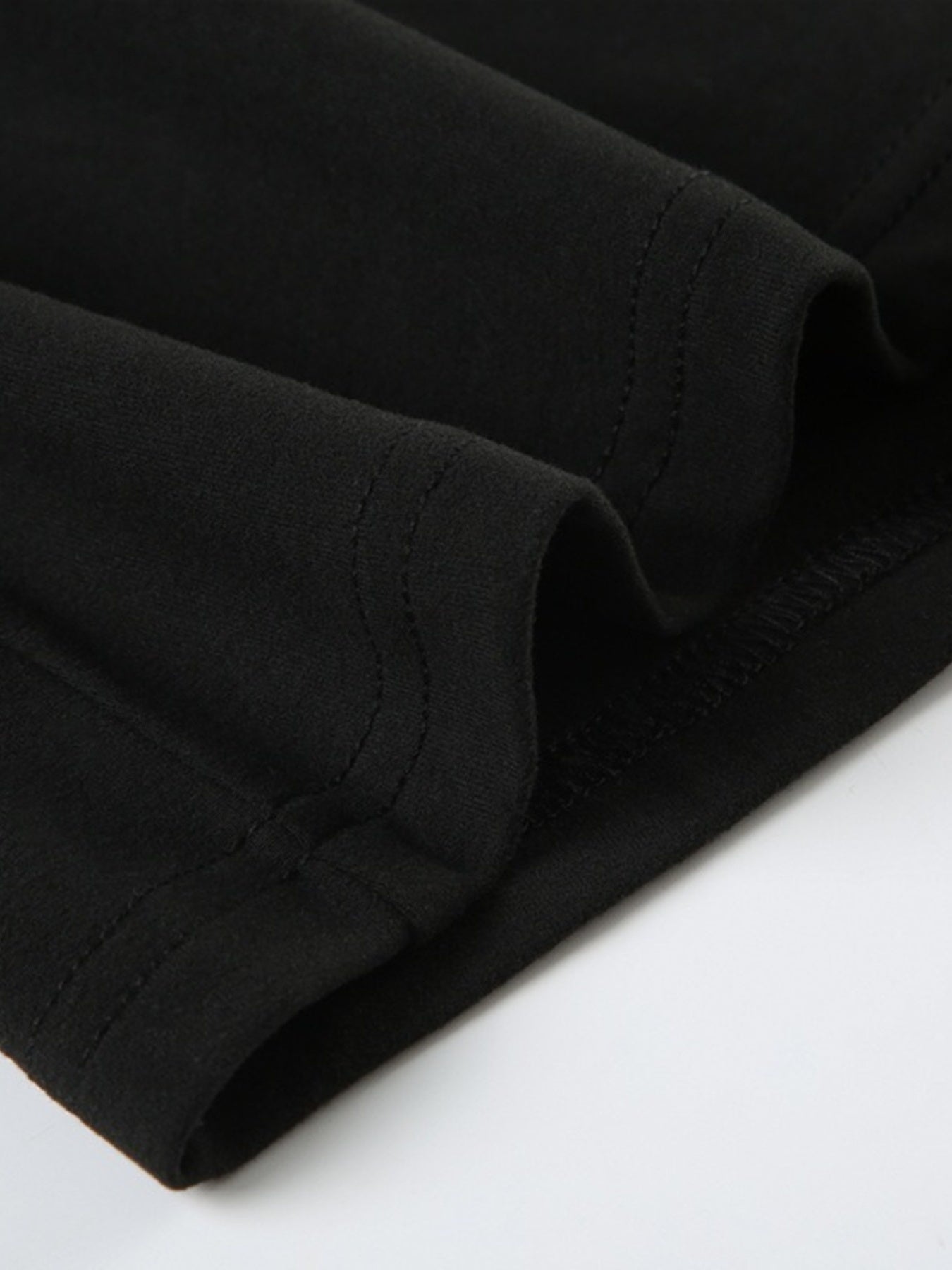 Ruched Long-Sleeve Active Romper in Black