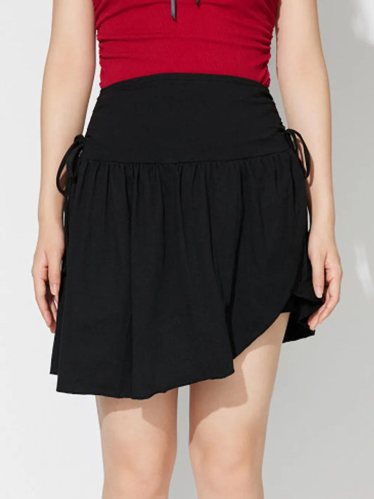 Side-Tie Asymmetric Hem Mini Skirt in Black