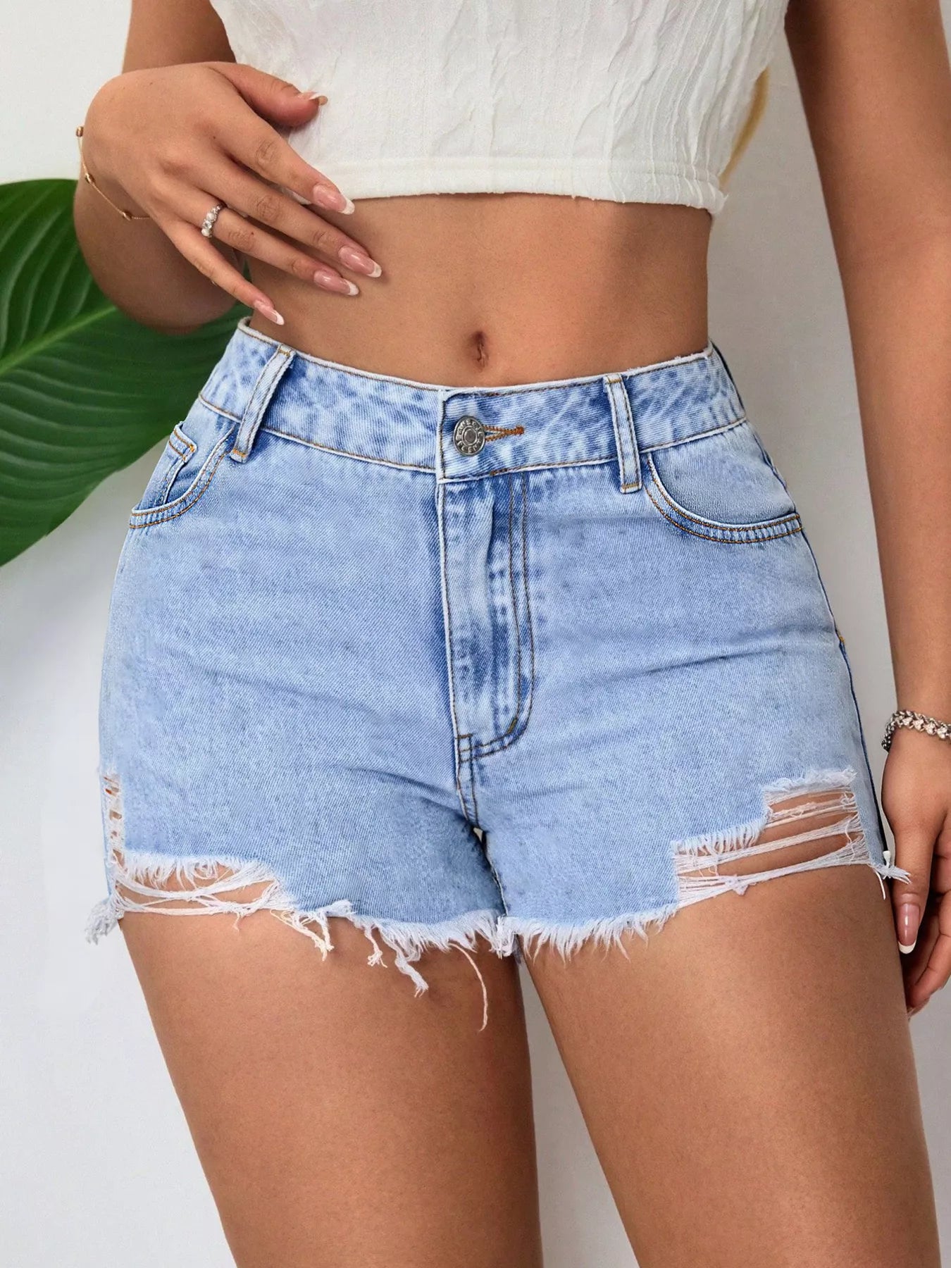 Distressed Raw Hem Denim Shorts in Blue