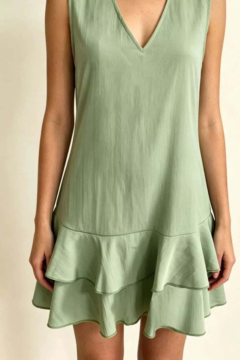 Sleeveless V-Neck Ruffle Hem Mini Dress in Beige