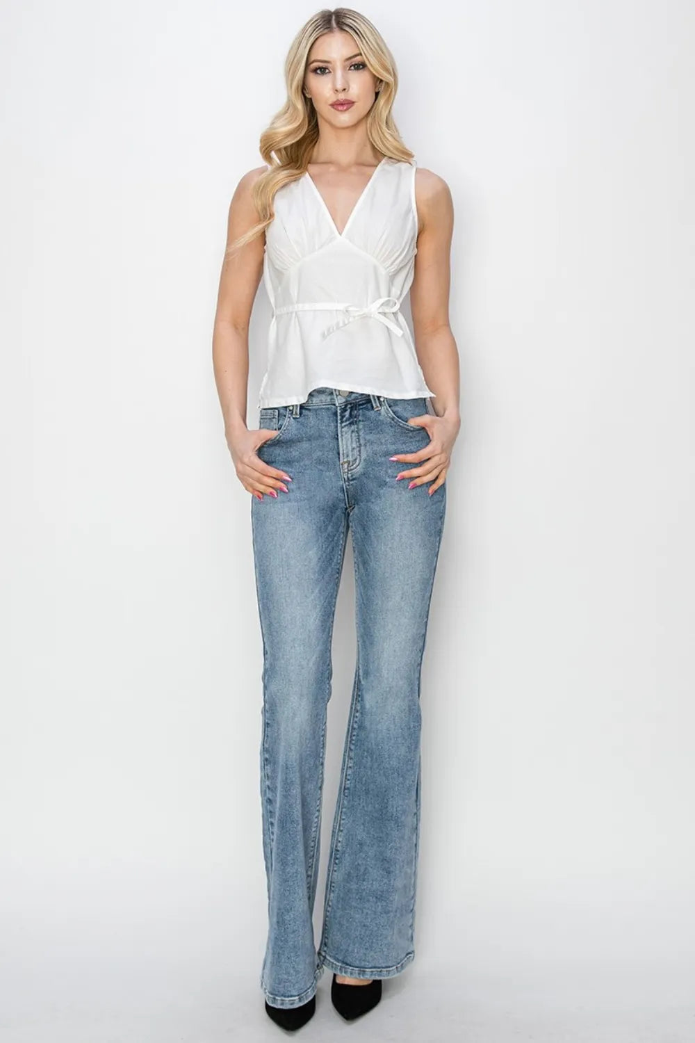 Risen Mid Rise Bootcut Jeans in Medium Wash