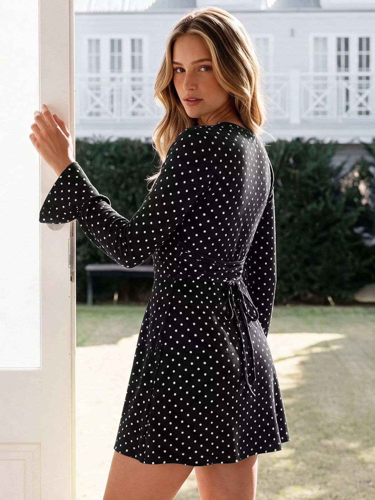 Polka Dot Long Sleeve Ruffle Hem Mini Dress in Black