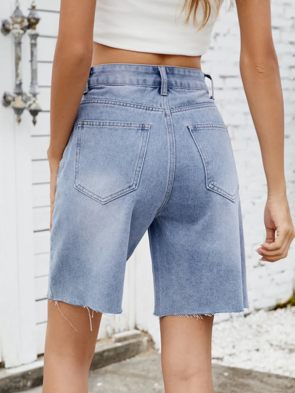 Washed Raw Hem Denim Shorts by Moni Wear