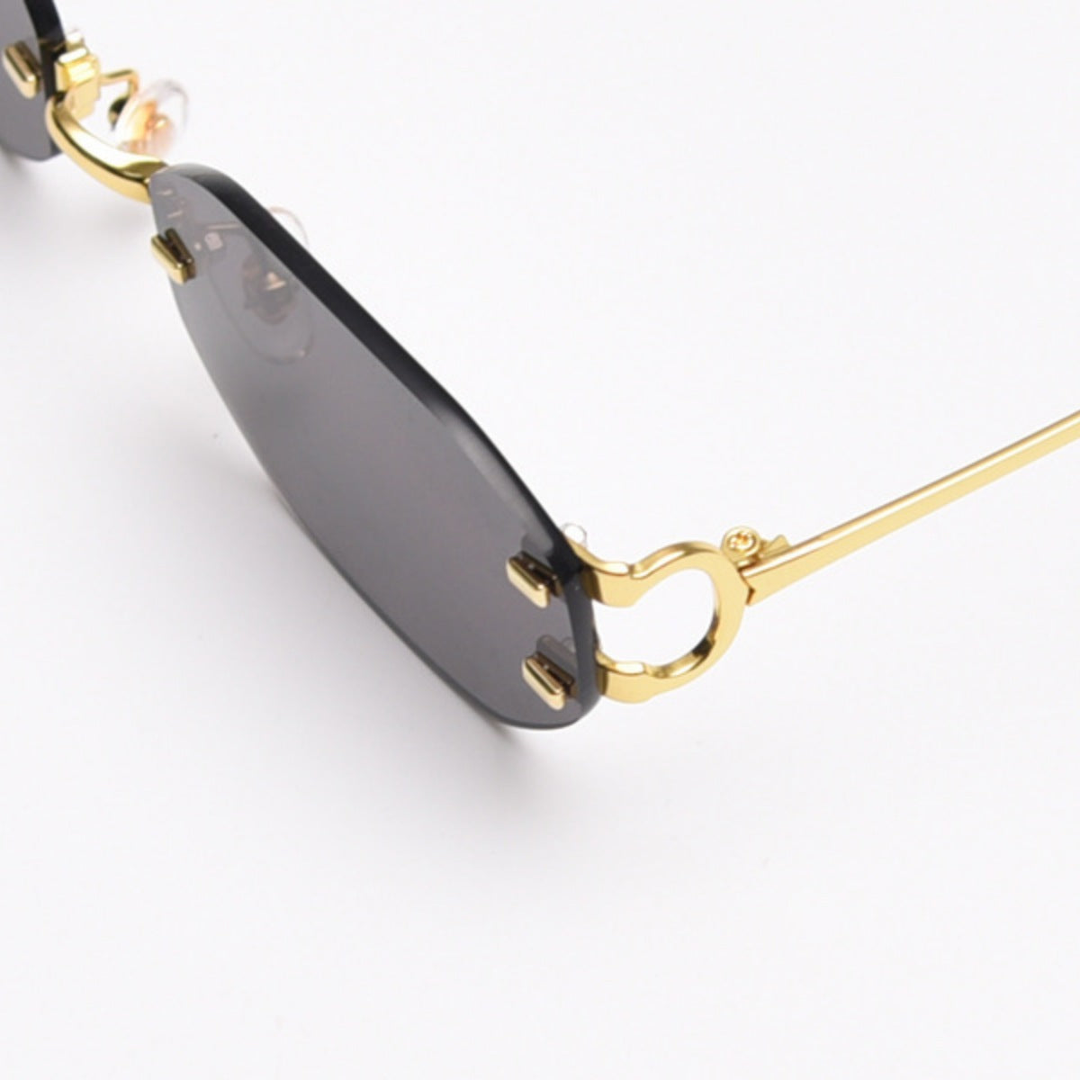 Ilussa Rimless Oval Sunglasses in gold