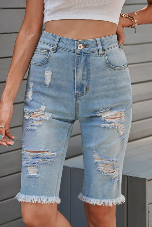Distressed Bermuda Shorts in Light Wash