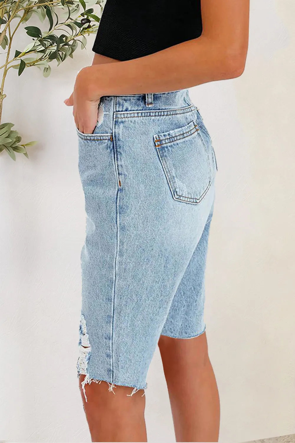 Distressed Pocketed Denim Shorts in Light Wash by DE.C.H & K.M