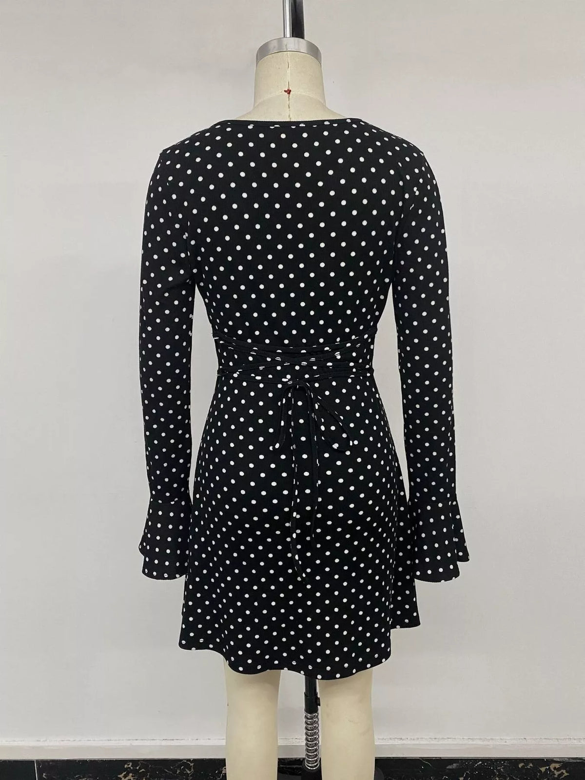Polka Dot Long Sleeve Ruffle Hem Mini Dress in Black