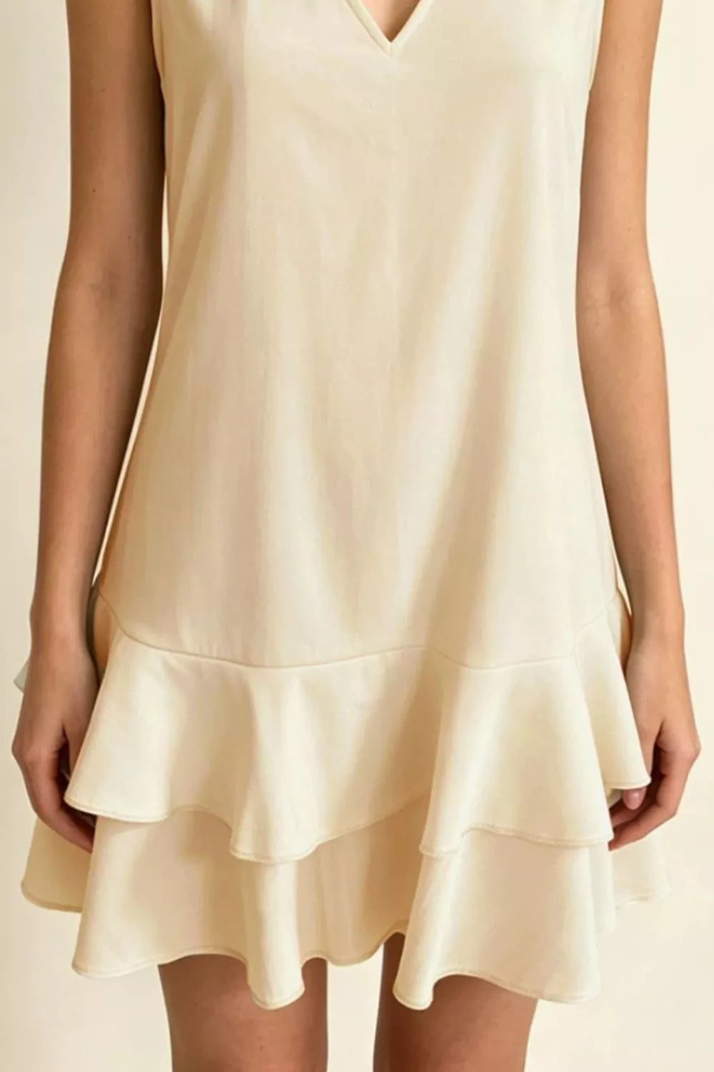 Sleeveless V-Neck Ruffle Hem Mini Dress in Beige